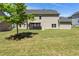 Expansive backyard with lush lawn, shade tree, gazebo and view of the house, ideal for recreation and outdoor enjoyment at 3051 Mountain Shadow Way, Marietta, GA 30064
