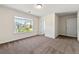 Bright bedroom with carpet, neutral walls, a ceiling light, and a window providing natural light and neighborhood views at 3051 Mountain Shadow Way, Marietta, GA 30064