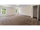 A large bedroom featuring natural light, carpeted floors, and a closet providing ample storage space at 3051 Mountain Shadow Way, Marietta, GA 30064
