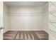 Spacious walk-in closet with carpeted floors and shelving for optimal organization at 3051 Mountain Shadow Way, Marietta, GA 30064