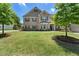 Charming two-story brick home boasts a well-manicured lawn and mature trees in a desirable neighborhood at 3051 Mountain Shadow Way, Marietta, GA 30064