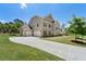 Spacious home with a long driveway leading to a two-car garage, surrounded by well-maintained landscaping at 3051 Mountain Shadow Way, Marietta, GA 30064