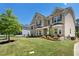 Beautiful brick home showcasing manicured landscaping, a well-maintained lawn, and charming curb appeal at 3051 Mountain Shadow Way, Marietta, GA 30064