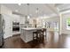 Bright kitchen features a center island, stainless steel appliances, and hardwood floors at 3051 Mountain Shadow Way, Marietta, GA 30064