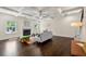 Spacious living room featuring coffered ceilings, fireplace and hardwood flooring at 3051 Mountain Shadow Way, Marietta, GA 30064