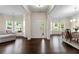 Open-concept living room with hardwood floors, large windows, and natural light at 3051 Mountain Shadow Way, Marietta, GA 30064