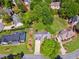 Aerial view of a home with a large backyard, landscaped grounds, and an inviting driveway with brick detailing at 579 Delphinium Nw Blvd, Acworth, GA 30102