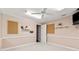 Finished basement with large mirrors, neutral paint, carpet, and a ceiling fan with lighting at 579 Delphinium Nw Blvd, Acworth, GA 30102
