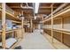 Spacious basement storage featuring concrete flooring and unfinished wood shelving along the walls at 579 Delphinium Nw Blvd, Acworth, GA 30102