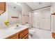 Bright bathroom featuring a shower-tub combo with a white sink and tile flooring at 579 Delphinium Nw Blvd, Acworth, GA 30102