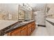 Bathroom featuring granite countertops, decorative wallpaper, and a glass door walk-in shower at 579 Delphinium Nw Blvd, Acworth, GA 30102