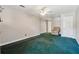 Bedroom with green carpet, neutral walls, and an accent chair at 579 Delphinium Nw Blvd, Acworth, GA 30102