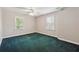 Bedroom featuring green carpet, neutral walls, and natural lighting at 579 Delphinium Nw Blvd, Acworth, GA 30102