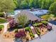 Community building with tennis and pool, lush landscaping and mature trees provide a serene environment at 579 Delphinium Nw Blvd, Acworth, GA 30102