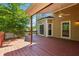 Large wooden deck with ceiling fan overlooking the backyard and exterior of the home at 579 Delphinium Nw Blvd, Acworth, GA 30102