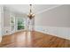 The dining room features hardwood floors, wainscoting, and a bay window at 579 Delphinium Nw Blvd, Acworth, GA 30102