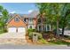 Beautiful two-story brick home with a two-car garage and meticulously landscaped front yard at 579 Delphinium Nw Blvd, Acworth, GA 30102