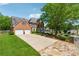 Charming two-story brick home featuring a two-car garage and a stone driveway border at 579 Delphinium Nw Blvd, Acworth, GA 30102