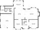Floor plan displaying the first floor, featuring a kitchen, dining room, living room, and a two-car garage at 579 Delphinium Nw Blvd, Acworth, GA 30102
