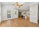 Bright open-concept living area with high ceilings and hardwood floors leads to the modern kitchen with a breakfast bar at 579 Delphinium Nw Blvd, Acworth, GA 30102
