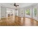 This living room features hardwood floors, a bay window, and access to kitchen at 579 Delphinium Nw Blvd, Acworth, GA 30102