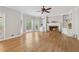 Spacious living room with a cozy fireplace and custom built-in shelving at 579 Delphinium Nw Blvd, Acworth, GA 30102