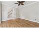 Open-concept living room featuring hardwood floors and an archway leading to the foyer at 579 Delphinium Nw Blvd, Acworth, GA 30102