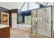 The main bathroom features a glass enclosed shower, soaking tub, and elegant wallpaper at 579 Delphinium Nw Blvd, Acworth, GA 30102