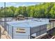 Community tennis court complex with multiple courts, a gazebo and team facilities for residents at 579 Delphinium Nw Blvd, Acworth, GA 30102