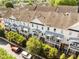 Aerial perspective of townhomes with private balconies and street parking at 735 Neel Reid Dr, Roswell, GA 30075