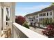 Balcony view of the community with multi-story townhomes, green trees and shrubs at 735 Neel Reid Dr, Roswell, GA 30075