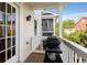Side of the house with an outdoor patio, grill, and nearby townhomes at 735 Neel Reid Dr, Roswell, GA 30075