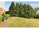 Dog park with green space, trees, dog waste station for residents and their furry friends at 735 Neel Reid Dr, Roswell, GA 30075