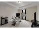 Bright home office with a modern glass top desk, storage, and a large window at 735 Neel Reid Dr, Roswell, GA 30075