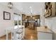 Open kitchen and breakfast nook filled with natural light, stainless appliances, and granite countertops at 735 Neel Reid Dr, Roswell, GA 30075