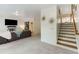 Cozy living room with natural light and easy access to the stairs and other rooms at 735 Neel Reid Dr, Roswell, GA 30075