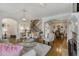 Elegant living room with hardwood floors, a fireplace, and an open floor plan at 735 Neel Reid Dr, Roswell, GA 30075