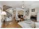 Bright living room features hardwood floors, a fireplace, and an elegant staircase at 735 Neel Reid Dr, Roswell, GA 30075