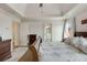Spacious main bedroom featuring tray ceilings, neutral colors, and an en suite bathroom at 735 Neel Reid Dr, Roswell, GA 30075