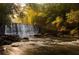 Scenic view of a waterfall, rocks, and lush greenery for relaxation and nature enjoyment at 735 Neel Reid Dr, Roswell, GA 30075