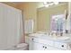 Bathroom featuring a bathtub, a large mirror, and a white marble vanity with gold fixtures at 1153 Brookhaven Commons Ne Dr, Brookhaven, GA 30319