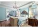Elegant bedroom with light blue walls, chandelier, and decorative headboard at 1153 Brookhaven Commons Ne Dr, Brookhaven, GA 30319