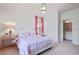 Bright bedroom with pink accents and an ensuite bathroom, creating a cohesive and comfortable space at 1153 Brookhaven Commons Ne Dr, Brookhaven, GA 30319