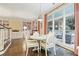Cozy dining area with hardwood floors, large windows overlooking the patio, and comfortable seating at 1153 Brookhaven Commons Ne Dr, Brookhaven, GA 30319