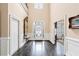 Inviting home foyer with hardwood floors, a decorative mirror, and ample natural light at 1153 Brookhaven Commons Ne Dr, Brookhaven, GA 30319