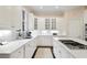 Modern kitchen with white cabinetry, marble countertops, and stainless steel appliances at 1153 Brookhaven Commons Ne Dr, Brookhaven, GA 30319