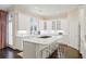 Bright, white kitchen featuring a large island, modern appliances, and ample cabinet space at 1153 Brookhaven Commons Ne Dr, Brookhaven, GA 30319