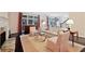 Bright living room features a cozy fireplace, stylish furniture, and large windows with backyard views at 1153 Brookhaven Commons Ne Dr, Brookhaven, GA 30319