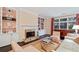 Inviting living room with fireplace, built-in shelving, and comfortable seating, creating a warm ambiance at 1153 Brookhaven Commons Ne Dr, Brookhaven, GA 30319