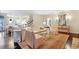 Open-concept living room with dining area and access to the kitchen, offering a seamless flow for modern living at 1153 Brookhaven Commons Ne Dr, Brookhaven, GA 30319
